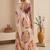 Cream women cream coloured purple floral printed pre draped saree