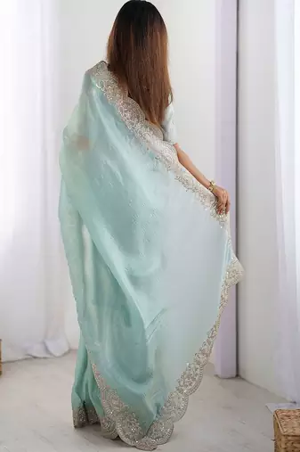 Green tissue silk sequence embroideried border blouse piece & sarees