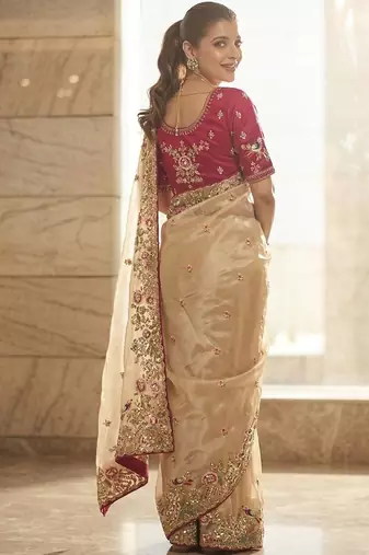 Beige embellished embroidered sequinned sarees with unstitched blouse piece