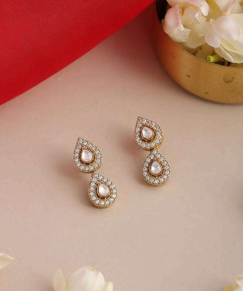 Gold plated kundan white stone stud earrings