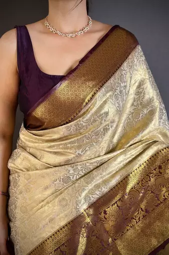 Cream floral woven design zari kanjeevaram saree with unstitched blouse piece