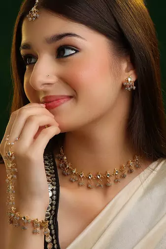Gold plated kundan grey beaded necklace set with maang tikka and haathphool