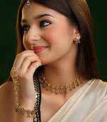 Gold plated kundan grey beaded necklace set with maang tikka and haathphool