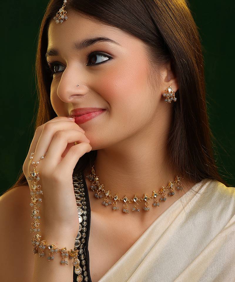 Gold plated kundan grey beaded necklace set with maang tikka and haathphool