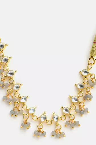 Gold plated kundan grey beaded necklace set with maang tikka and haathphool
