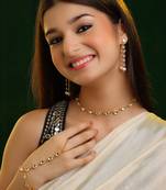 Gold plated kundan white beaded necklace set with haathphool