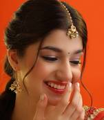 Gold plated kundan green and white beaded maang tikka with earrings