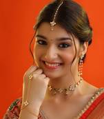 Gold plated kundan green stones necklace set with maang tikka and haathphool