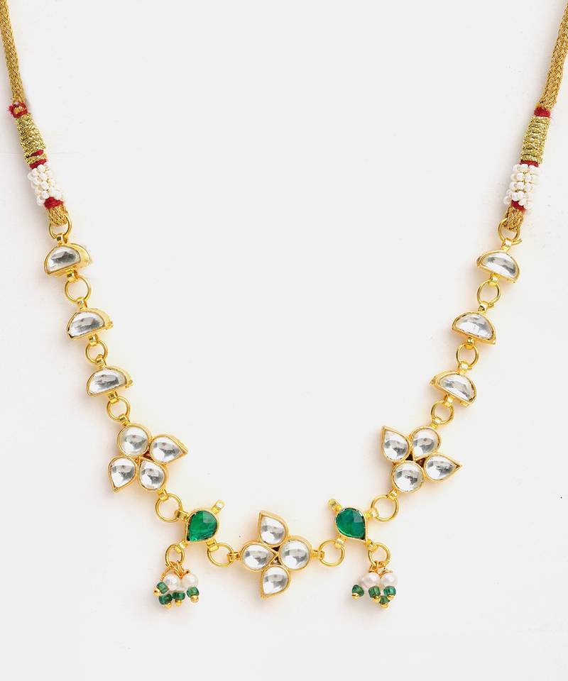 Gold plated kundan green stones necklace set with maang tikka and haathphool
