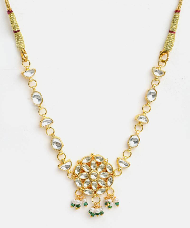 Gold plated kundan green beaded necklace set with maang tikka