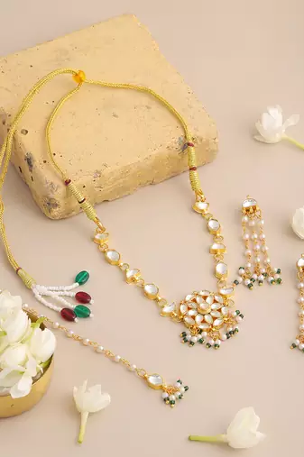 Gold plated kundan green beaded necklace set with maang tikka