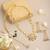 Gold plated kundan green beaded necklace set with maang tikka