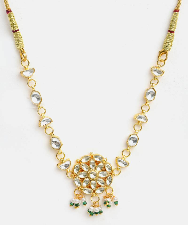 Gold plated kundan green beaded necklace set with maang tikka