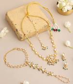 Gold plated kundan green beaded necklace set with maang tikka and haathphool