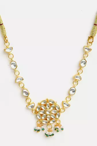 Gold plated kundan green beaded necklace set with maang tikka and haathphool