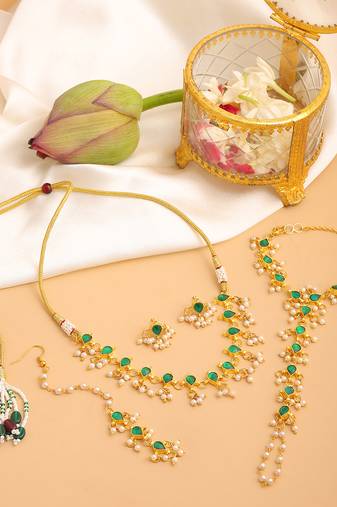 Gold plated kundan green stone necklace set with maang tikka and haathphool