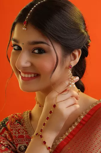 Gold plated kundan red stones necklace set with maang tikka and haathphool