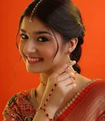 Gold plated kundan red stones necklace set with maang tikka and haathphool