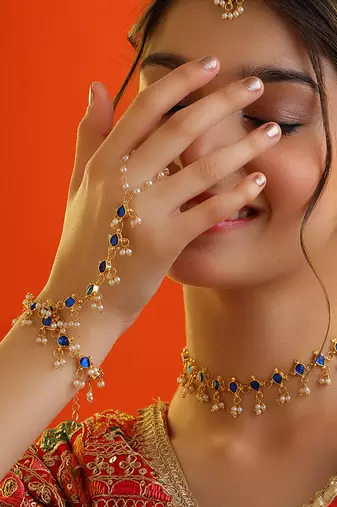 Gold plated kundan blue stones necklace set with maang tikka and haathphool