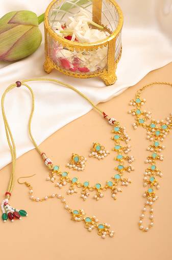 Gold plated kundan mint green stones necklace set with maang tikka and haathphool