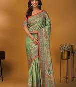 Green paisley printed banarasi saree with unstitched blouse piece