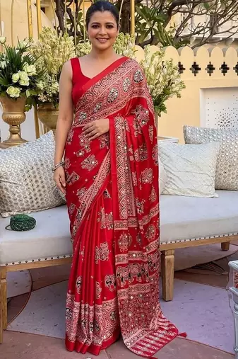Red women embellished mirror work saree