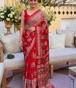 Red women embellished mirror work saree
