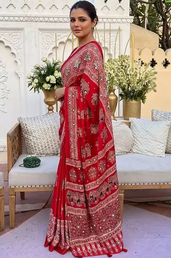 Red women embellished mirror work saree