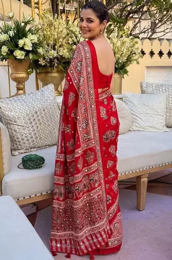 Red women embellished mirror work saree