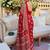 Red women embellished mirror work saree
