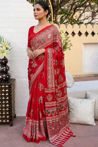 Red women embellished mirror work saree