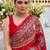 Red women embellished mirror work saree