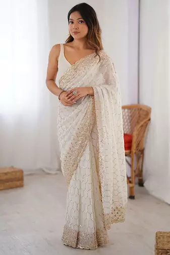 Off white sequinned  georgette embellished party wear saree with matching blouse