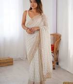 Off white sequinned  georgette embellished party wear saree with matching blouse