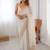 Off white sequinned  georgette embellished party wear saree with matching blouse