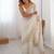 Off white sequinned  georgette embellished party wear saree with matching blouse