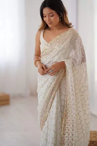Off white sequinned  georgette embellished party wear saree with matching blouse