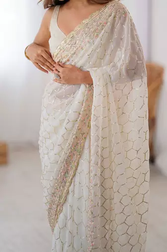 Off white sequinned  georgette embellished party wear saree with matching blouse