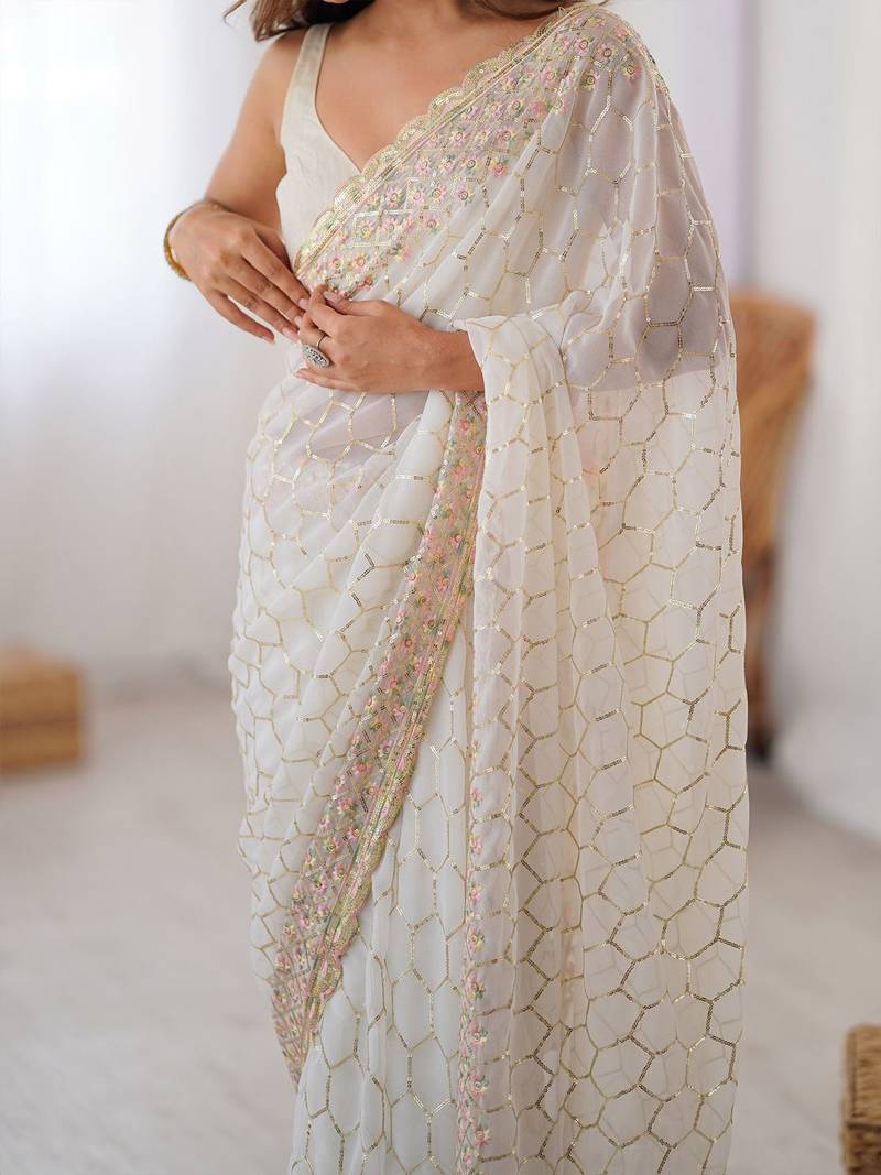 Off white sequinned  georgette embellished party wear saree with matching blouse