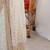 Off white sequinned  georgette embellished party wear saree with matching blouse