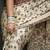 Cream paisley mirror work bandhani saree