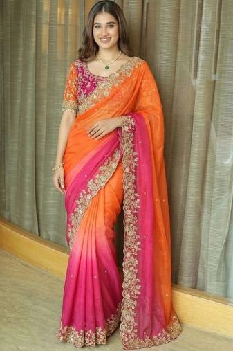 Orange ethnic motifs embroidered satin heavy work saree