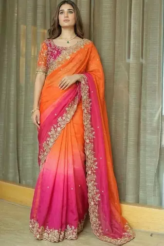 Orange ethnic motifs embroidered satin heavy work saree