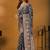 Teal floral printed banarasi saree with unstitched blouse piece