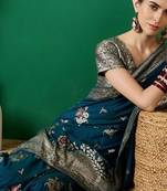 Teal ethnic motif zari woven tassel detail kanjeevaram saree with blouse