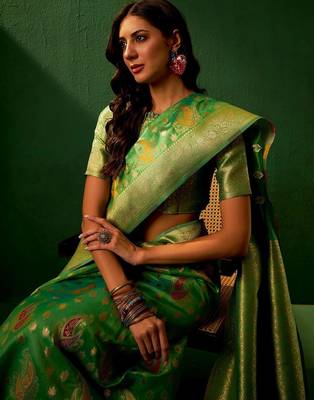 Green ethnic motifs woven designed kanjeevaram saree 1
