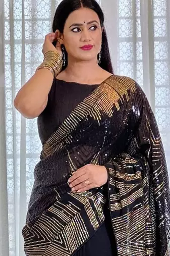 Black embellished party wear saree with matching blouse