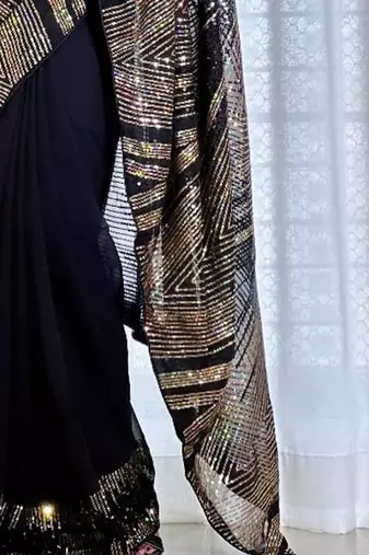Black embellished party wear saree with matching blouse