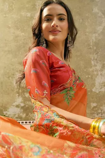 Orange floral sequinned organza heavy work saree
