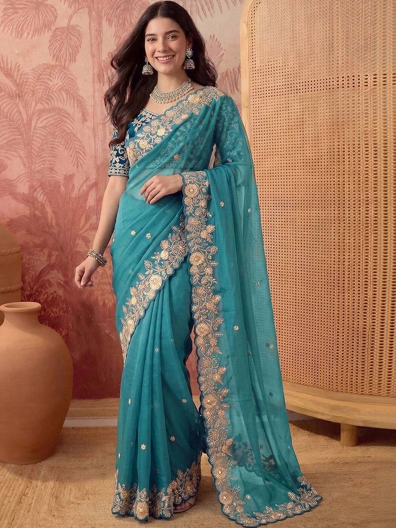 Teal embellished embroidered poly georgette saree